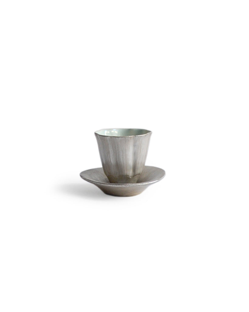 http://shop.nalatanalata.com/cdn/shop/products/Masanobu_Ando_SIlver_Blue_Lined_Teacup_3.jpg?v=1621096141