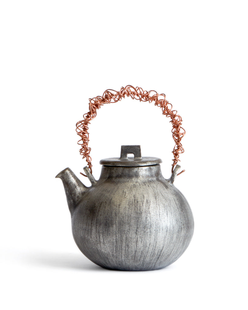 http://shop.nalatanalata.com/cdn/shop/products/Masanobu_Ando_Silver_Copper_Teapot_3.jpg?v=1527124771