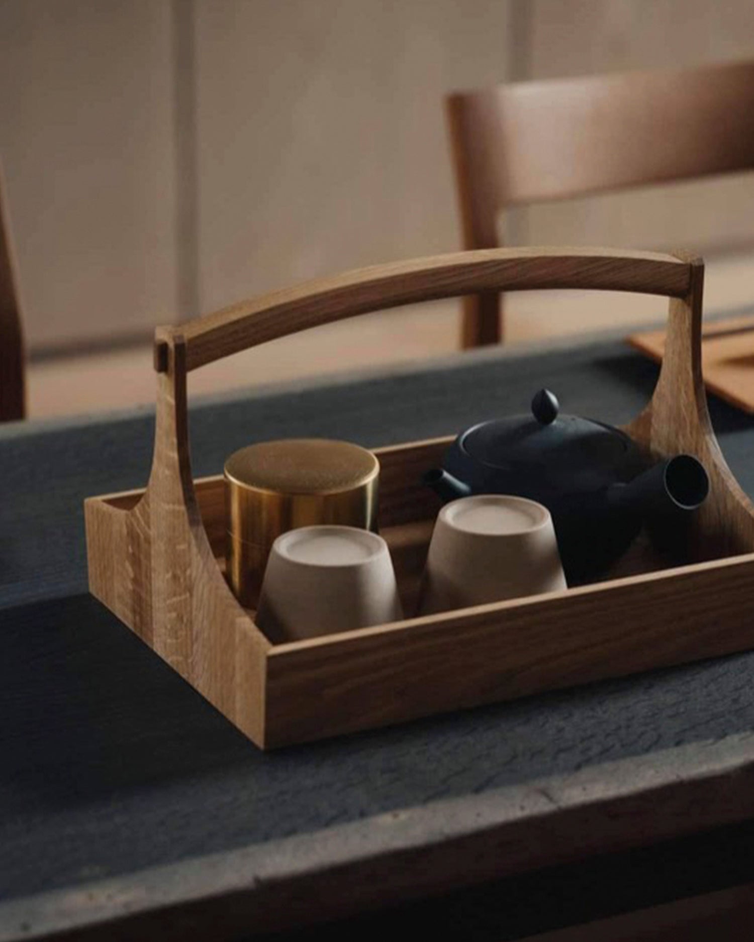 Large wooden table caddy by Aizawa with short handles, carrying a tea set on a wooden surface