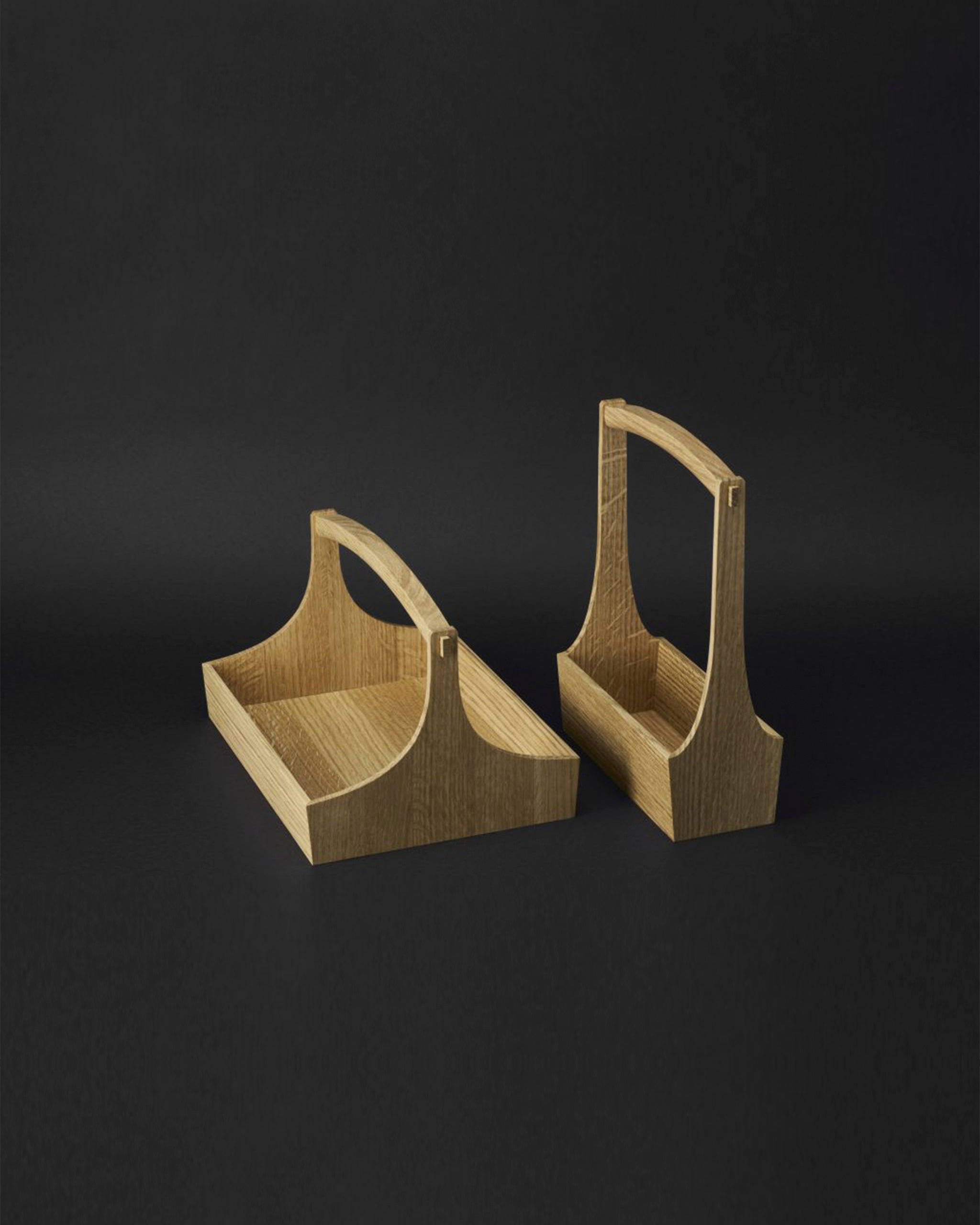 Two wooden table caddies in size large and small by Aizawa with handles on a dark background