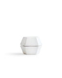 White geometric spice mill on a white background