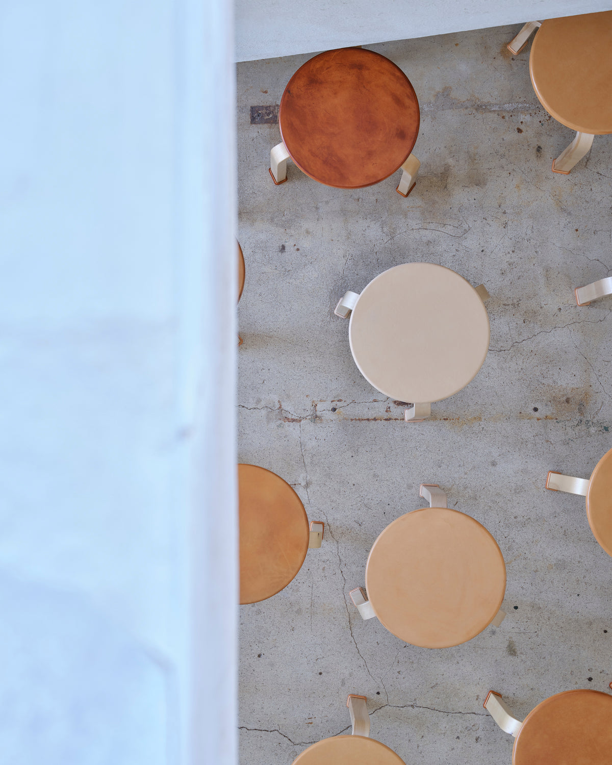 Stools with shoes by Artek and Hender Scheme 