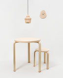 Table 90c, Stool 60, Pendant Light, and Clock by Hender Scheme and Artek on a gray background