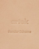 Up-close of Coaster by Hender Scheme and Artek on a gray background