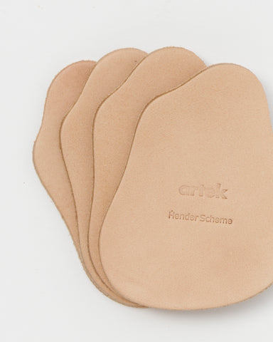 Stacked coasters by Hender Scheme and Artek on a gray background