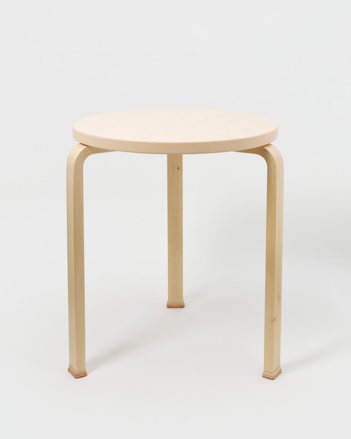 Table with Shoes by Artek and Hender Scheme on gray background