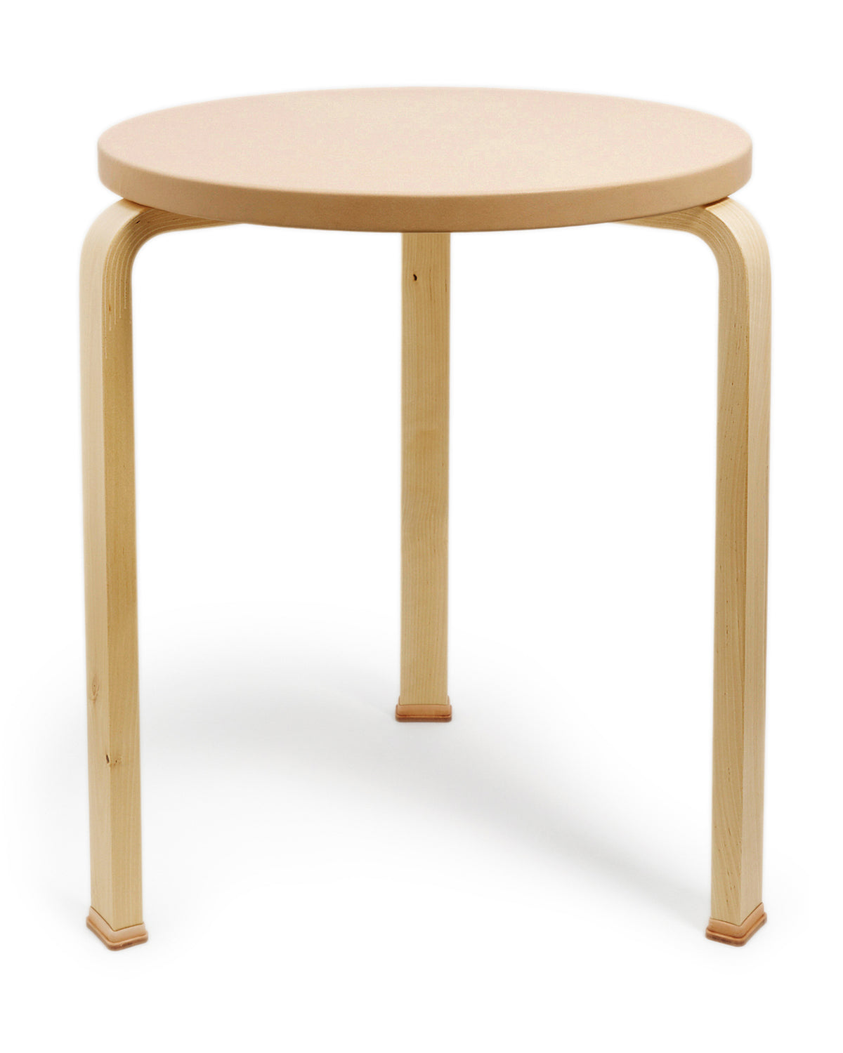 Leather table with shoes by Hender Scheme and Artek on a white background
