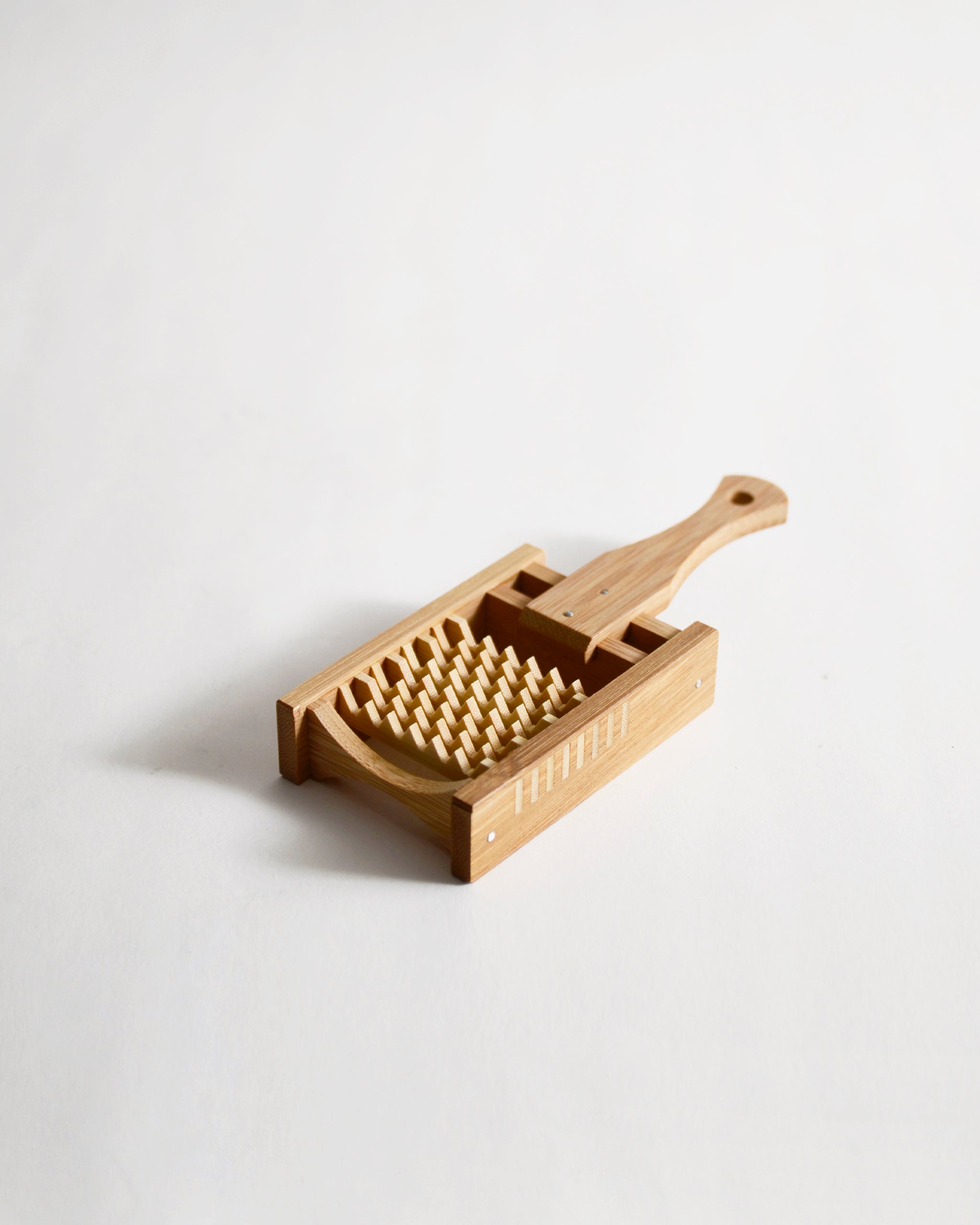 Bamboo Daikon Grater by Kohchosai Kosuga in Small size on a gray background