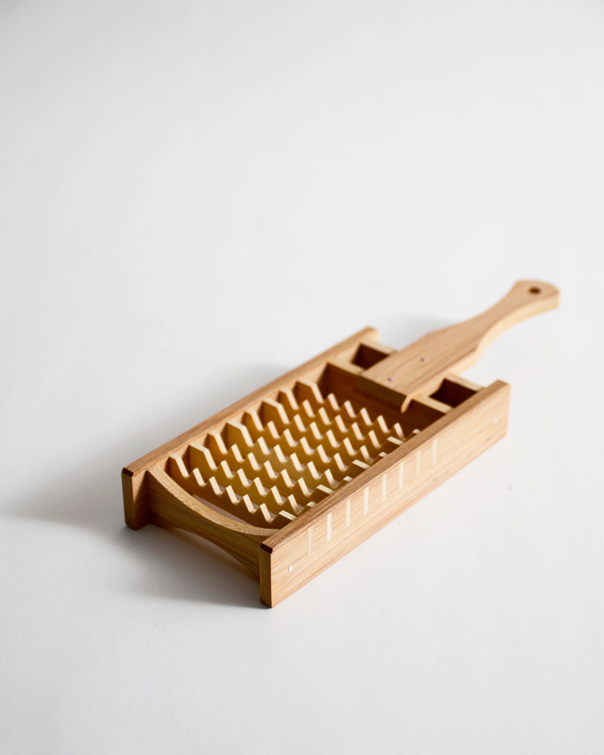 Bamboo Daikon Grater by Kohchosai Kosuga in Large size on a gray background