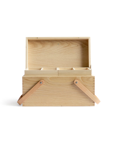 Silhouetted image of open chestnut wood picnic box featuring wood joinery on edges by Shinsuke Tanabe against white background.