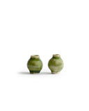 Two gloss green miniature vases from the Mini Vase Set - Duo I standing side by side against white. A Dani Sujin Studio x Nalata Nalata Collaboration