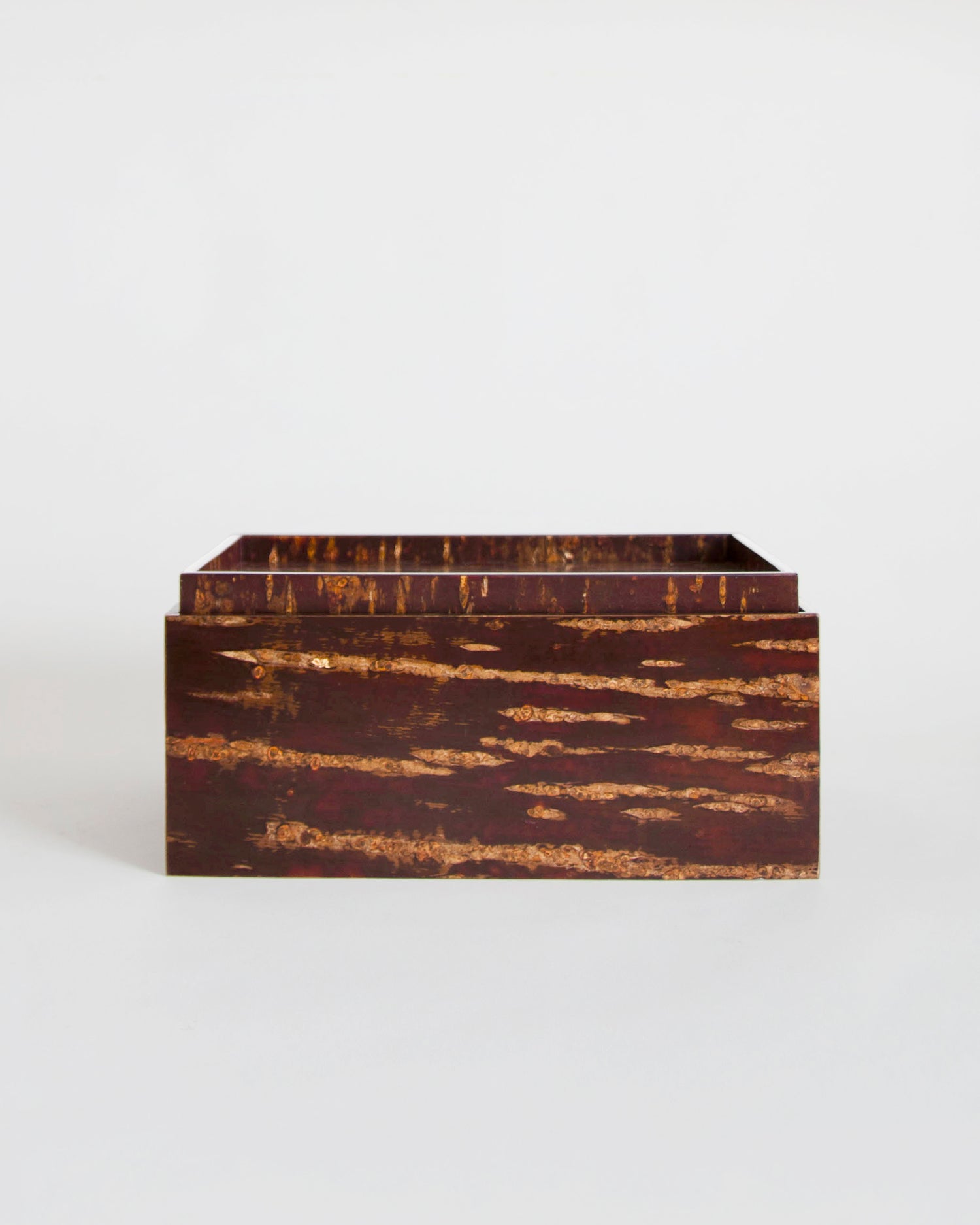 Wooden box by Denshiro on a gray background