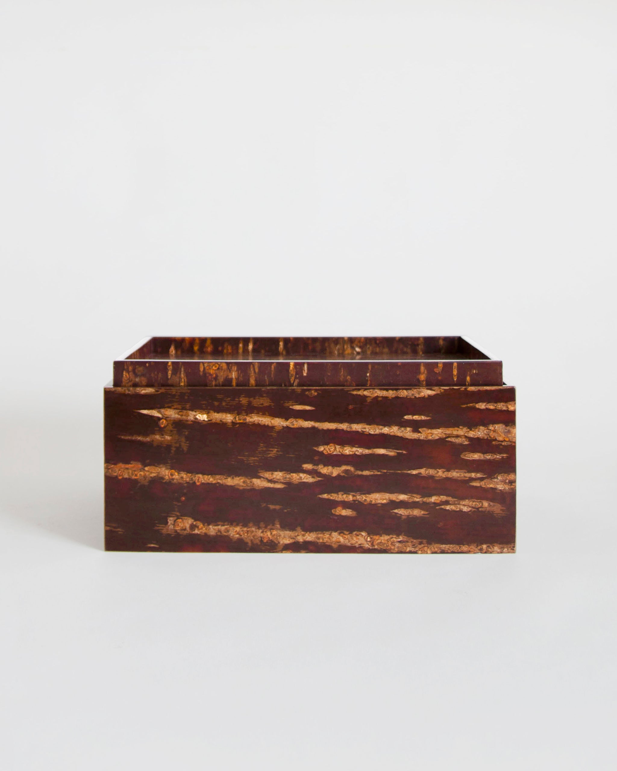 Wooden box by Denshiro on a gray background
