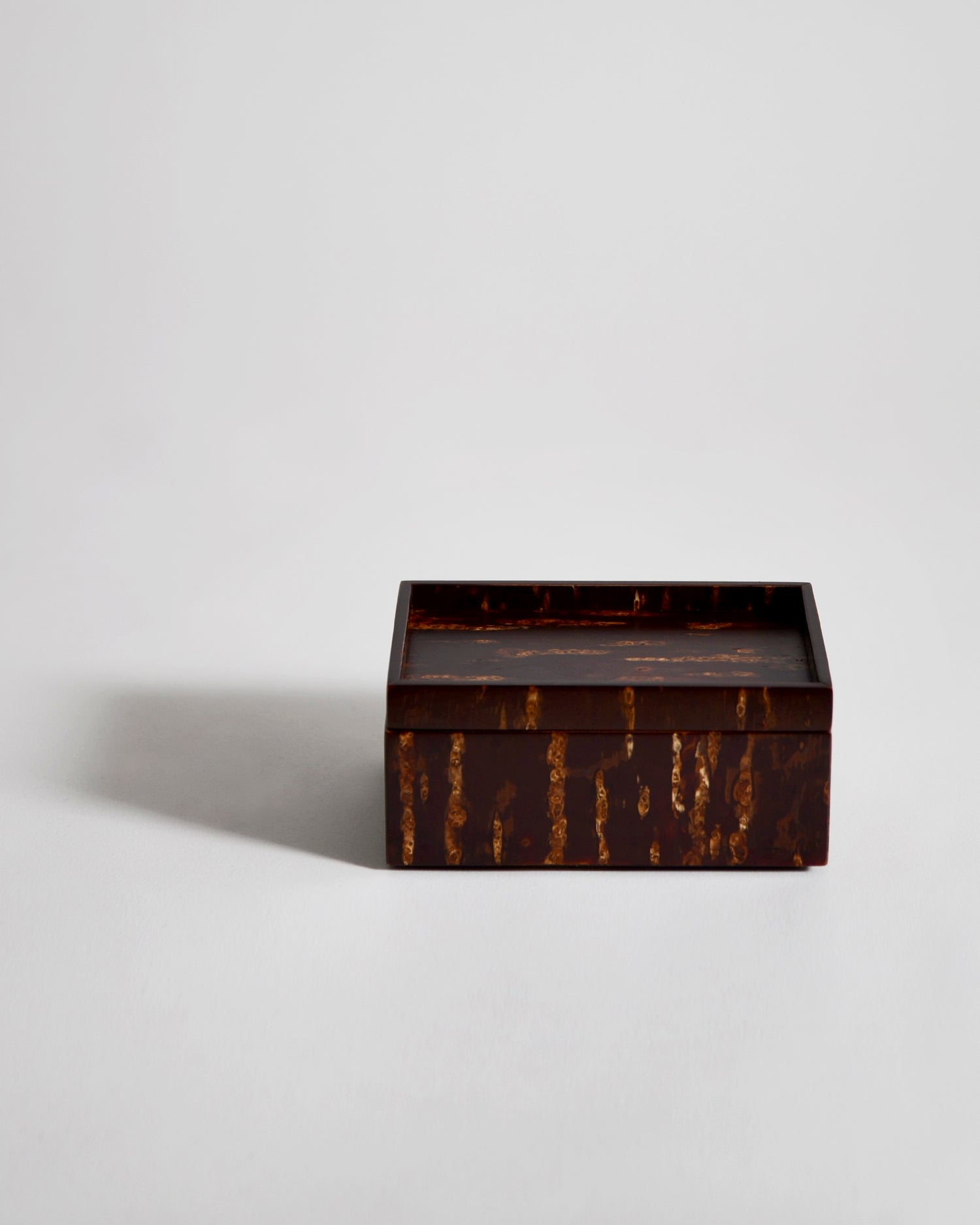 Wooden box by Denshiro on a light gray background