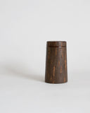 Wooden cylindrical coffee container by Denshiro on a gray background