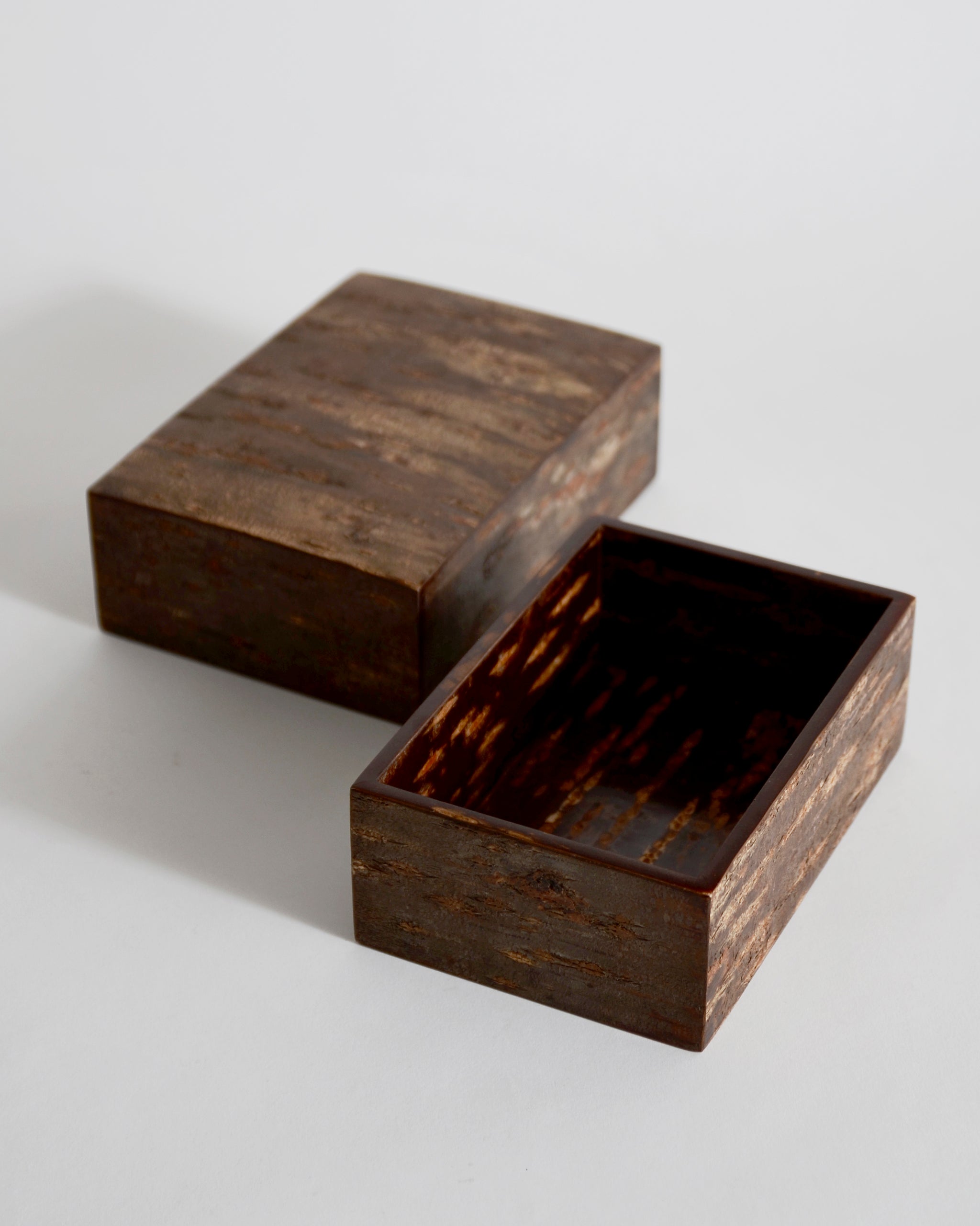 Open wooden large box with lid by Denshiro on a light gray background