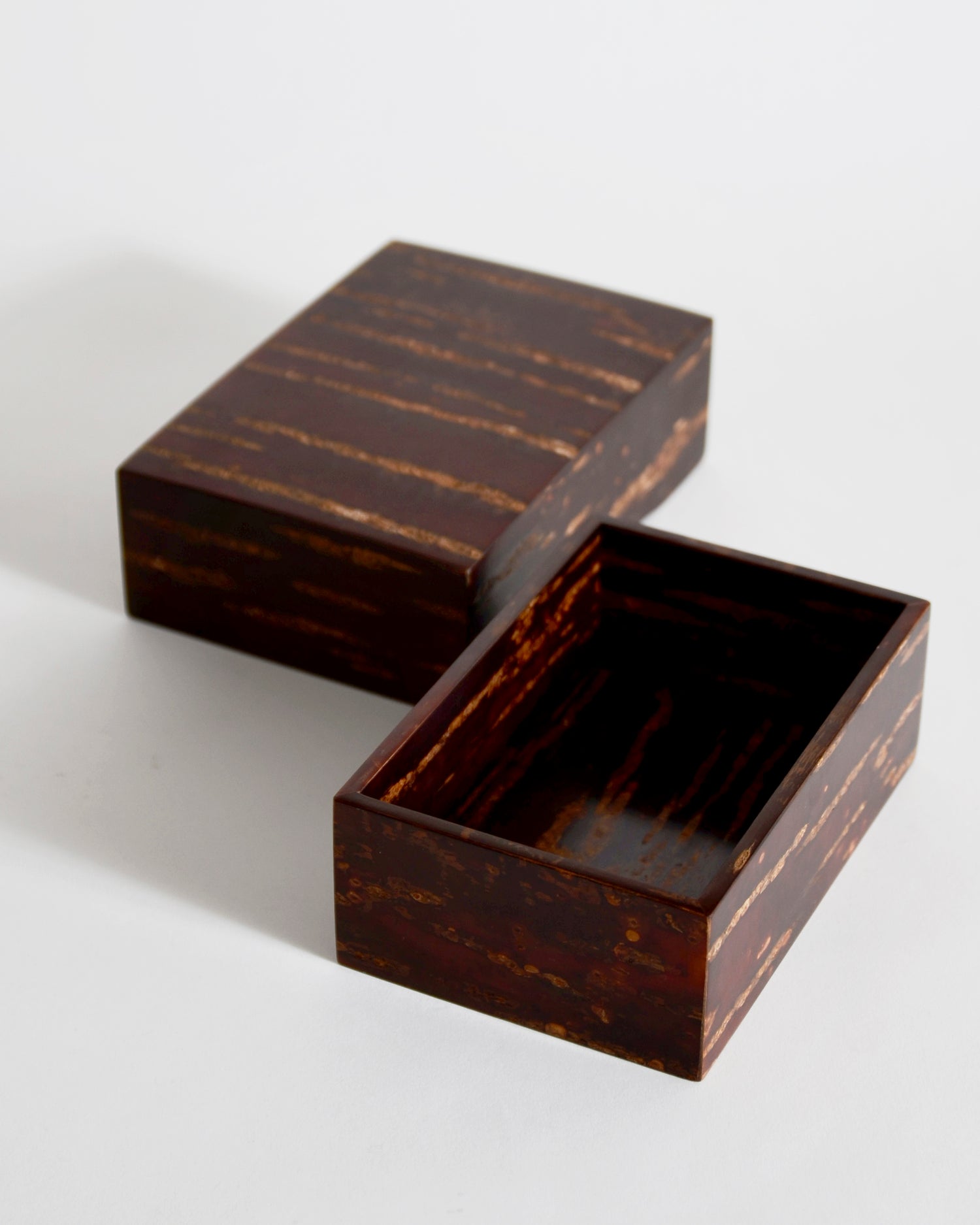 Opened wooden box with lid side by side by Denshiro on a white background