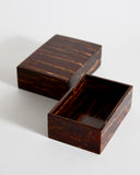 Opened wooden box with lid side by side by Denshiro on a white background