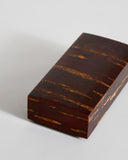 Small rectangular smooth wooden box on a gray background