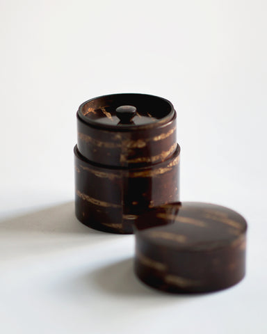 Image of open short Smooth Cherry Bark Tea Canister by Denshiro against white-gray background with lid placed infront.