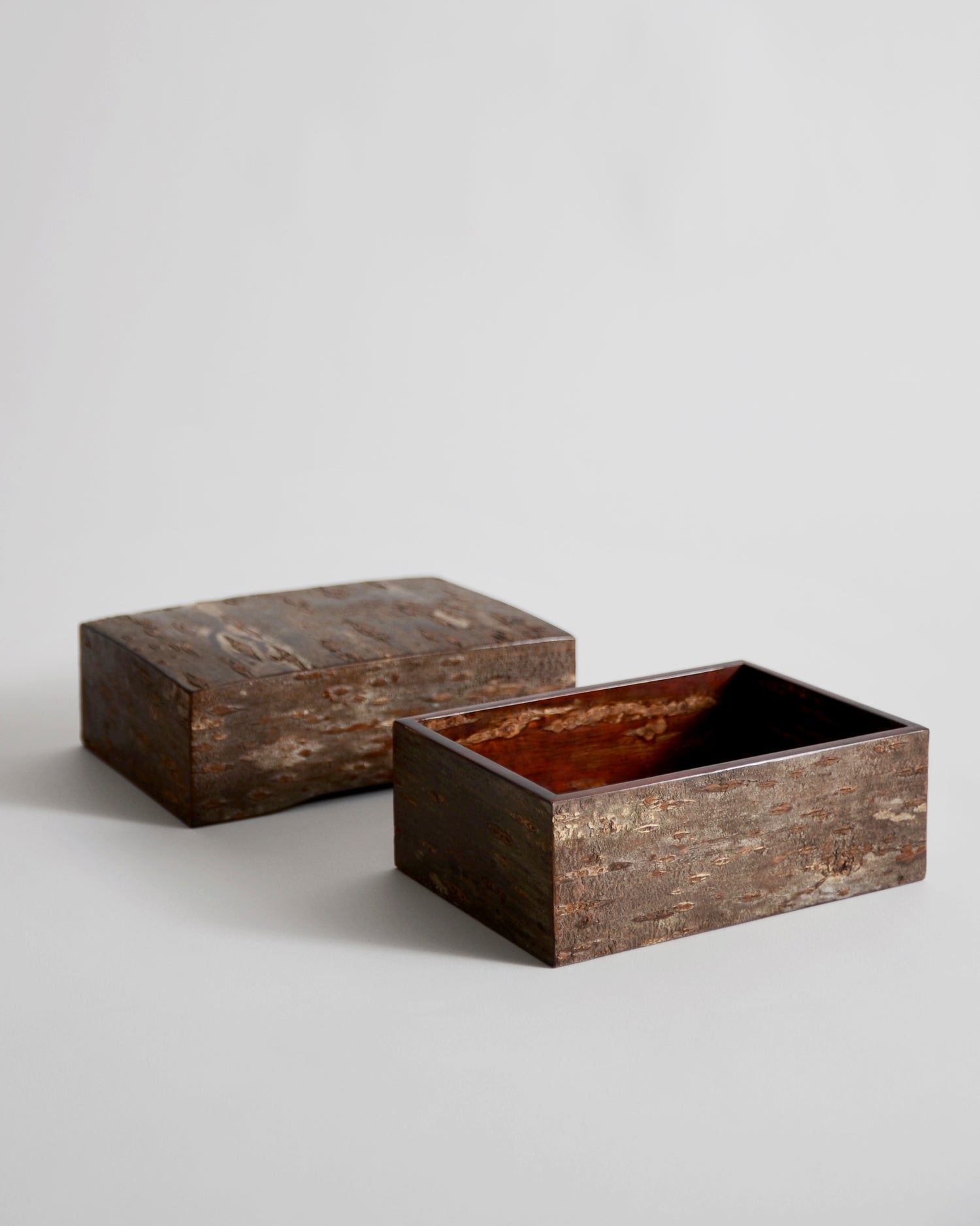 Open wooden large box with lid by Denshiro on a light gray background