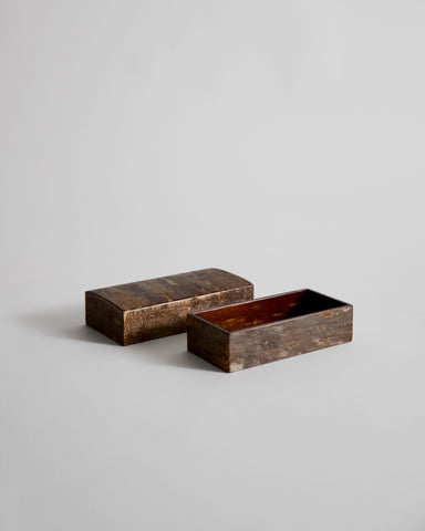 Open wooden small box with lid by Denshiro on a light gray background