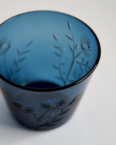 Detailed top view of the reclaimed blue ms.garden daily cup in deep blue. Features a focus on carved flower and leaves pattern in front of the cup.