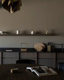 Arc lantern by Futagami on a shelf in a kitchen surrounded by other items.