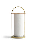 Silhouetted futagami brass towel holder holding a paper towel against white background.