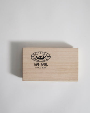 Wooden box with Pastels Gondola branding on a light gray background