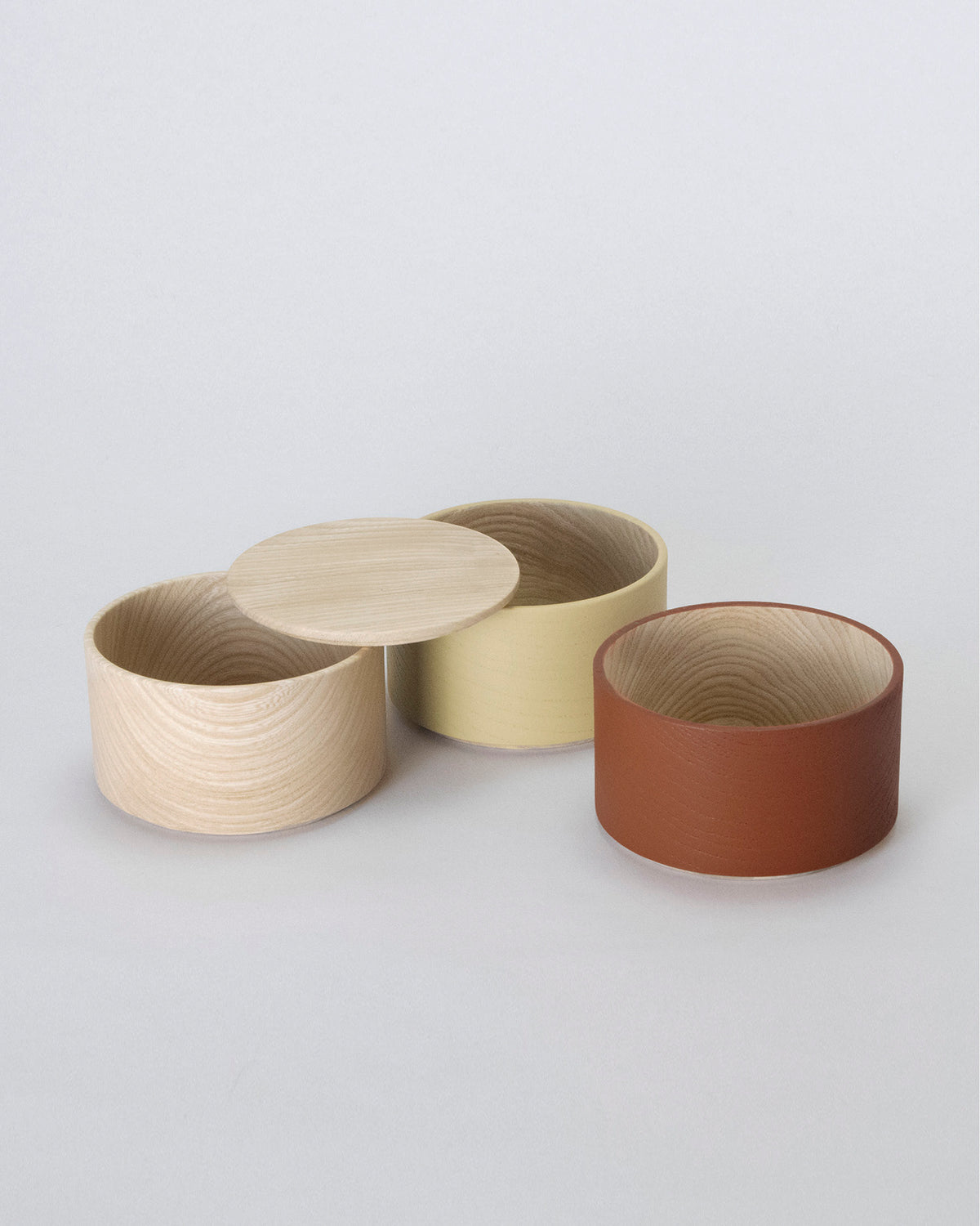 Unstacked Border Three Tiered Containers in Brown, Mustard, Natural on a white background