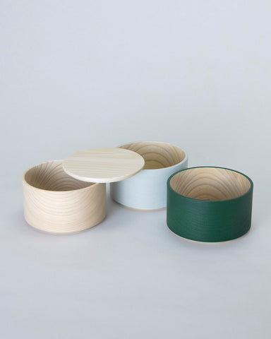 Unstacked Border Three Tiered Containers in Emerald, Blue Gray, Natural on a white background