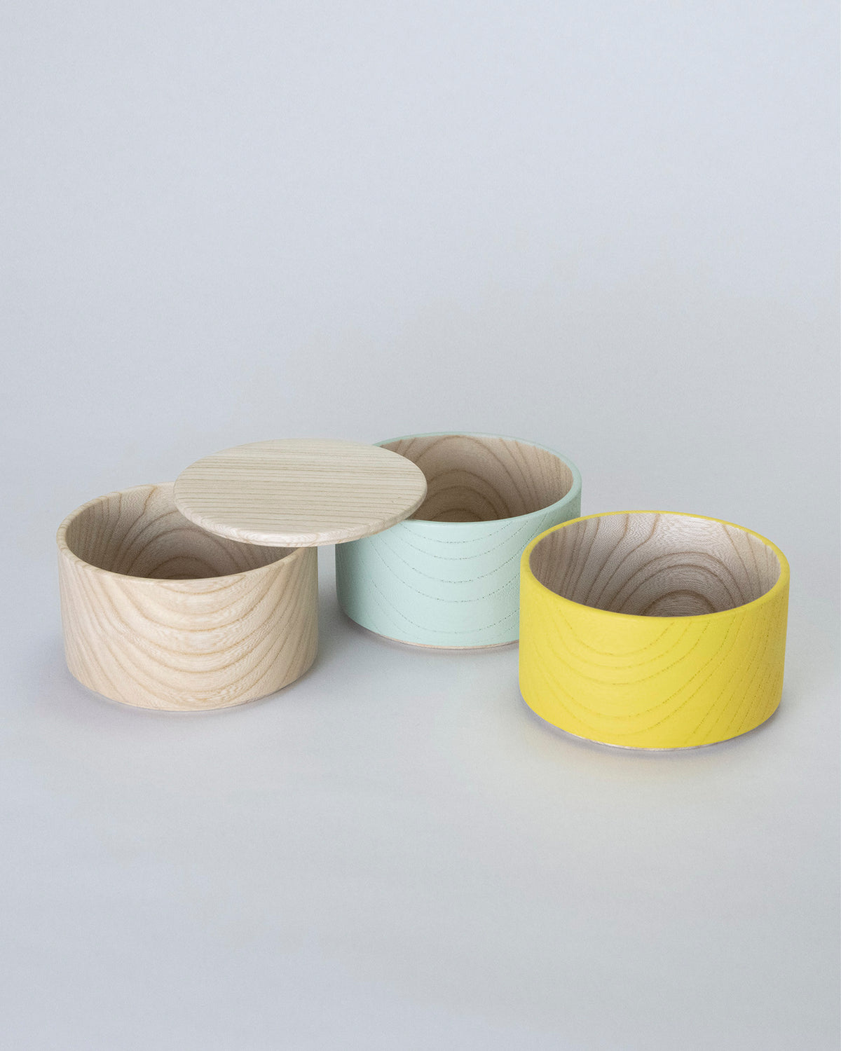 Unstacked Border Three Tiered Containers in Yellow, Mint, Natural on a white background