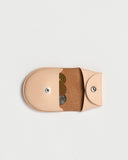 Open Coin Case by Hender Scheme on a gray background