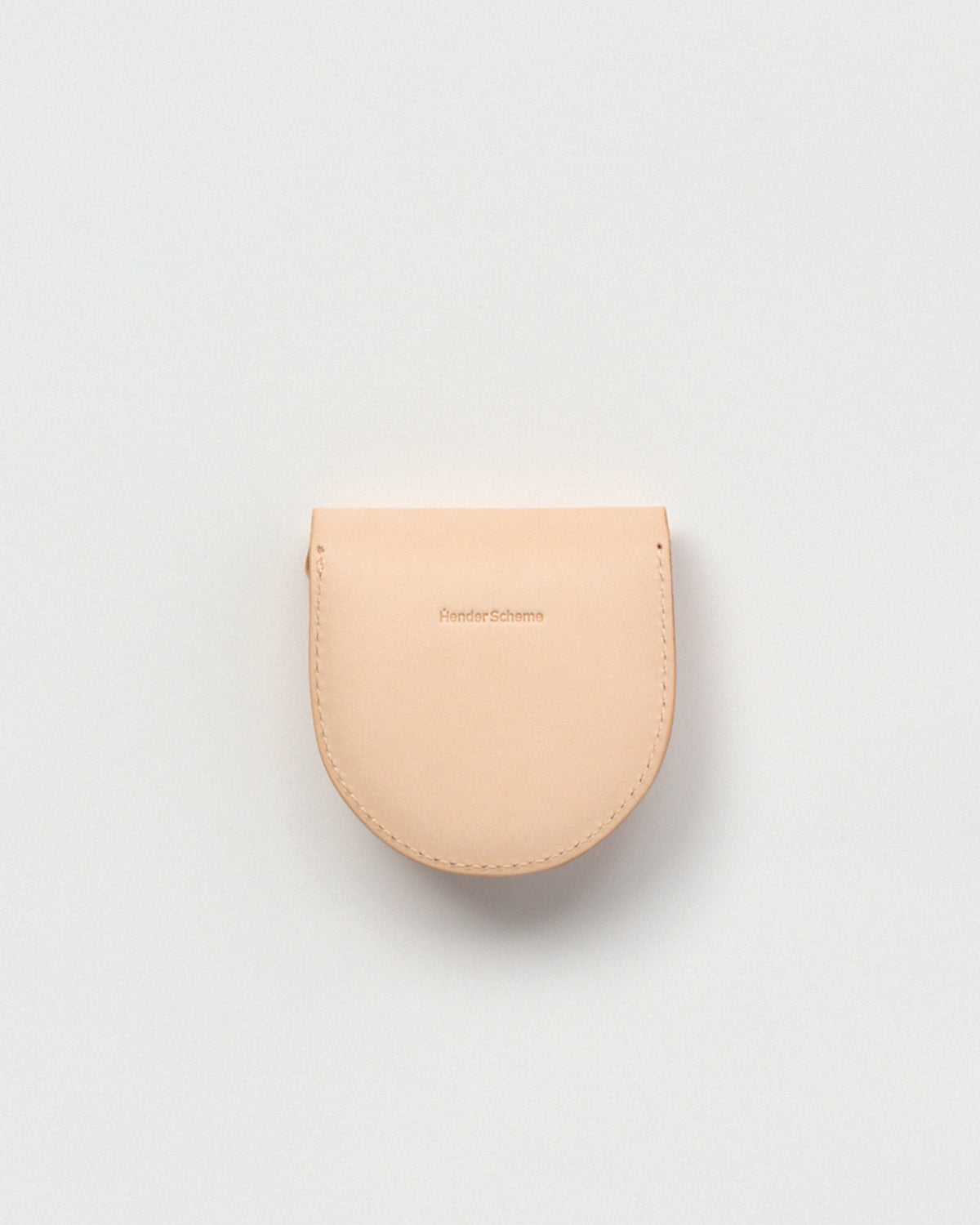 Back side of Coin Case by Hender Scheme on a gray background