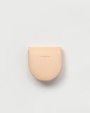 Back side of Coin Case by Hender Scheme on a gray background