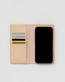 Open iPhone Case by Hender Scheme  with credit cards and phone on a gray background