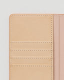 Close-up of open iPhone Case by Hender Scheme of card slots on a gray background.