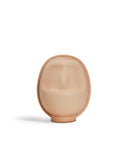 Large leather Daruma doll by Hender Scheme on  a white background