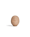 Small leather Daruma doll by Hender Scheme on  a white background