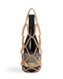 Wine bottle in wine holder by Hender Scheme with a white background