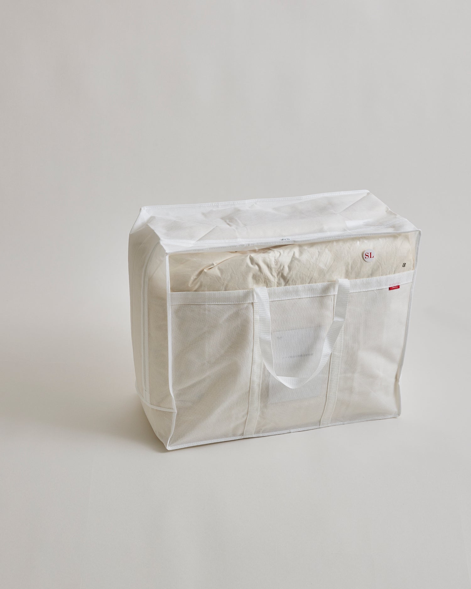 Storage bag for Heavy Duvet by Iwata on a gray background