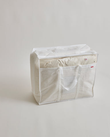 Storage bag for Heavy Duvet by Iwata on a gray background
