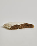 Interior of Camel Heavy Mattress Pad by Iwata on a gray background
