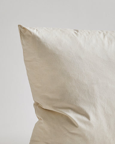 Close-up of Down and Feather Pillow by Iwata on gray background
