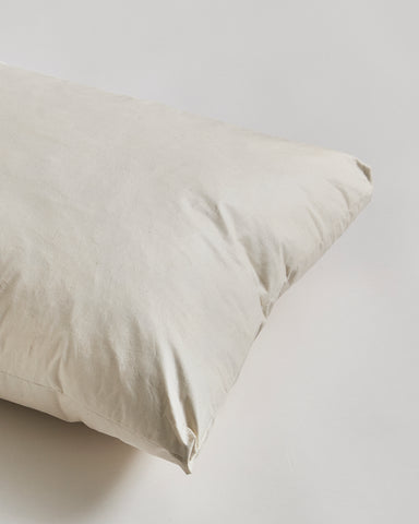 Close-up of Down and Feather Pillow by Iwata on gray background