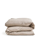  unbleached linen duvet cover on a duvet folded on a gray background