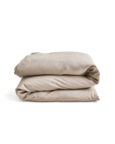  unbleached linen duvet cover on a duvet folded on a gray background