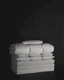 Folded futon set by Iwata on a black background