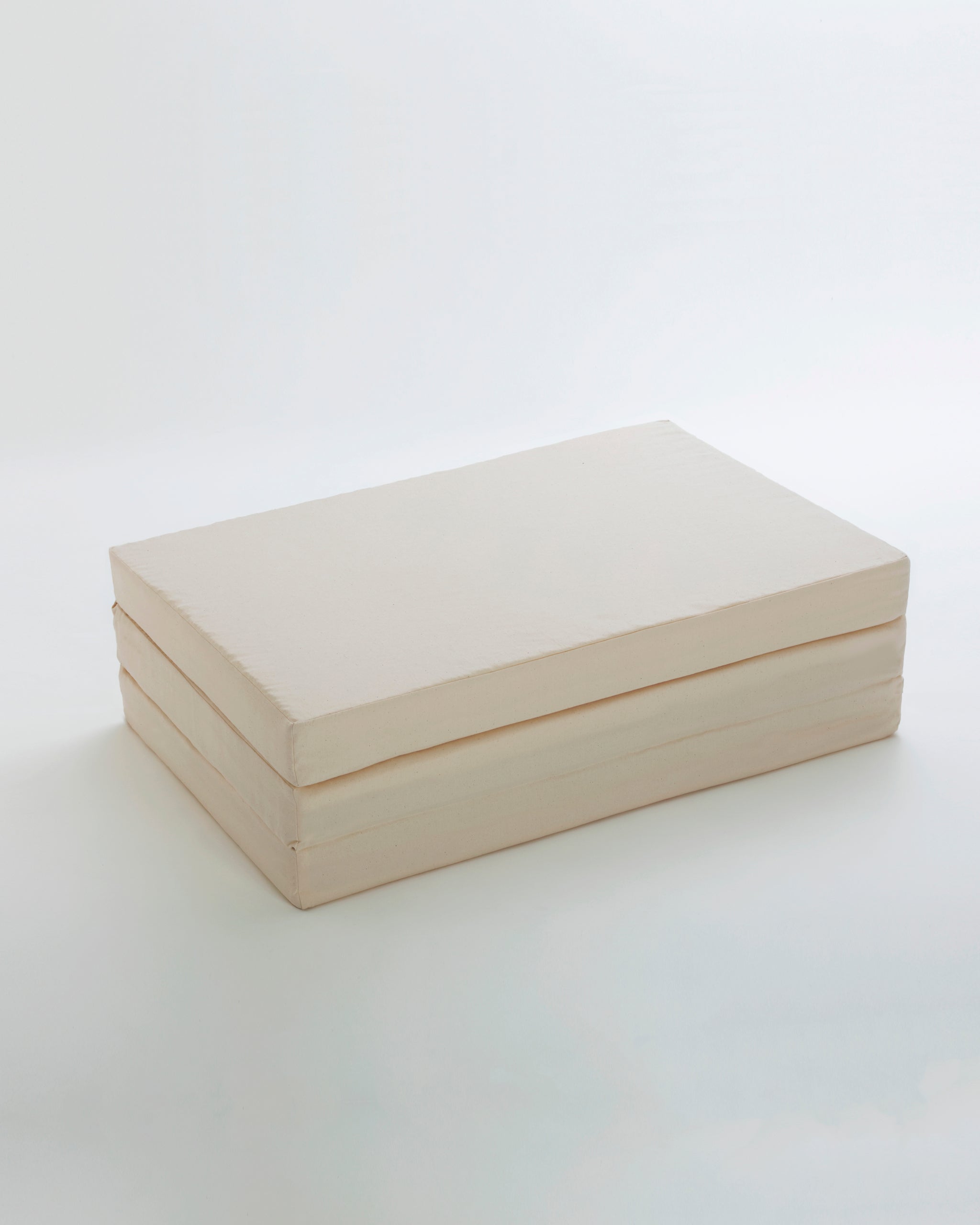 Folded Futon Floor Pad by Iwata on a white background
